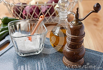 Salt, pepper mill, and olive oil Stock Photo