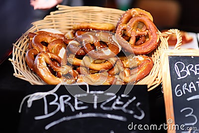 Salt pretzels and other bread for sale on traditional European local farmer market Stock Photo