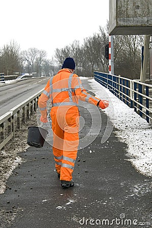 Salt Spreader in colorful work clothes, Jirnsum Editorial Stock Photo