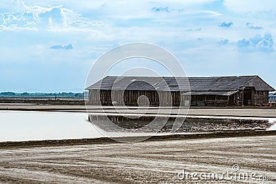 Salt storage granaries, sea salt storage in salt farms. Granary for salt storage and salt farm Solar. Abandoned old wood salt barn Stock Photo