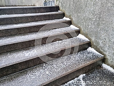 Salted concrete stairs winter in Denmark - prevention of ice formation Stock Photo