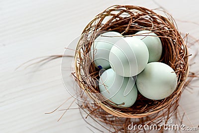 salted duck eggs can be seen from the top of the rattan container and white background Stock Photo