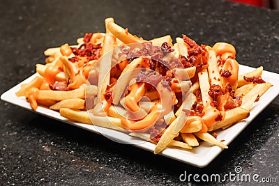 Salty Cheese French Fries with Bacon Stock Photo