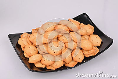 Salty & Crispy baked biscuit in black tray Stock Photo