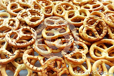 Salty crispy cracker mini pretzels texture background Stock Photo