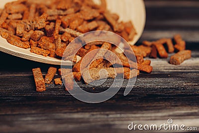 salty croutons snacks delicacy meal wooden table Stock Photo