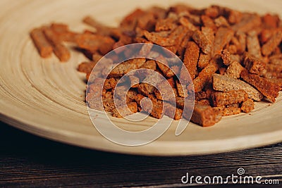 salty croutons snacks delicacy meal wooden table Stock Photo
