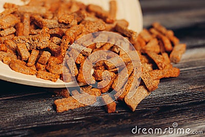 salty croutons snacks delicacy meal wooden table Stock Photo