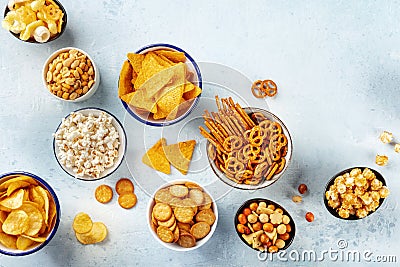 Salty snacks, party mix, overhead flat lay shot. An assortment of appetizers Stock Photo