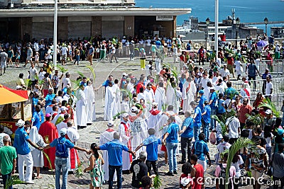 Catholic priests and faithful are seen during the Palm Sunday procession Editorial Stock Photo