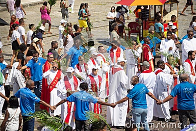 Catholic priests and faithful are seen during the Palm Sunday procession Editorial Stock Photo