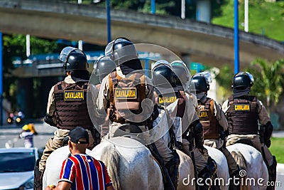 Military police cavalry doing security outside the football stadium for Bahia vs Vitoria game in Salvador, Bahia Editorial Stock Photo