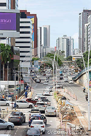 Salvador, Bahia, Brazil - August 11, 2023: View of a street close to Avenida Tancredo Neves with a construction site on the side Editorial Stock Photo