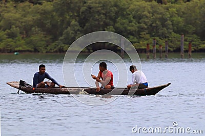 Salvador Bahia Brazil. 03/12/2017. Boys fishing in a type of rustic boat in the bay of Todos os Santos. Editorial photo Editorial Stock Photo