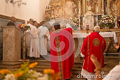 Catholic priests are seen celebrating mass for Santa Luzia in the city of Salvador, Bahia Editorial Stock Photo