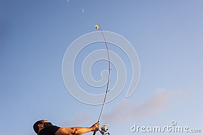 Fisherman in action with his pole in Ponta do Humaita Stock Photo