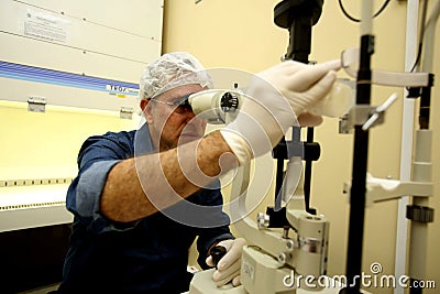 Ophthalmologist makes corneal processing Editorial Stock Photo