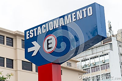 A sign indicating the direction to a car parking lot in the city of Salvador, Bahia Editorial Stock Photo