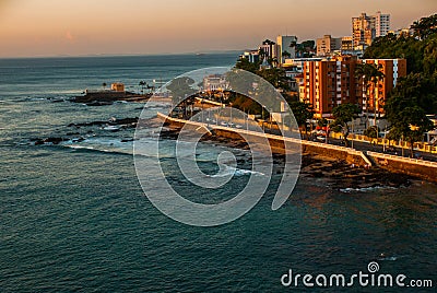 SALVADOR, BRAZIL: Colonial Fort Santa Maria in Barra Salvador Brazil built on tropical beach with palm trees Stock Photo