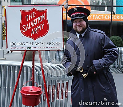 Salvation Army soldier perform for collections in midtown Manhattan Editorial Stock Photo