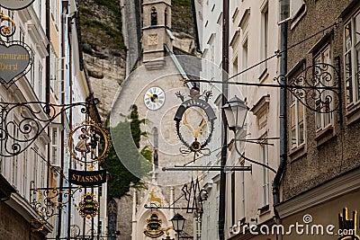 Salzburg, Austria, 28 August 2021: Grain Lane or Getreidegasse famous shopping narrow street in historic Altstadt or Old Town, Editorial Stock Photo