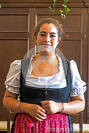 Salzburg. Waiter In one of the national Austrian cuisine restaurants Editorial Stock Photo