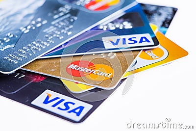 Samara, Russia- 3 February 2015: Closeup studio shot of credit cards issued by the three major brands American Express, VISA and Editorial Stock Photo