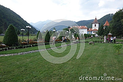 Sambata de Sus Monastery in Romania, with Carpathians mountains in the background Stock Photo