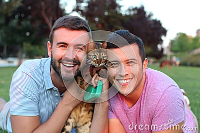 Same sex couple with a gorgeous pet outdoors Stock Photo