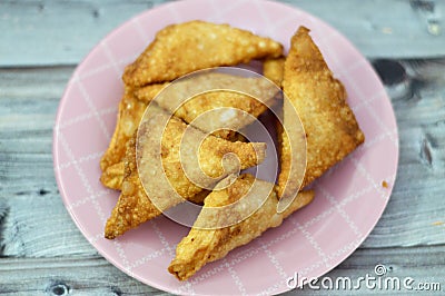 A samosa Singara, a fried South Asian pastry with a Savoury filling including ingredients like spiced potatoes, onions, peas, meat Stock Photo