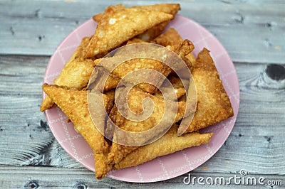 A samosa Singara, a fried South Asian pastry with a Savoury filling including ingredients like spiced potatoes, onions, peas, meat Stock Photo