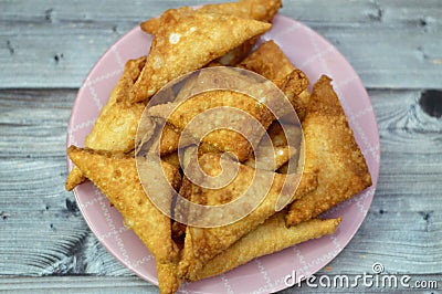 A samosa Singara, a fried South Asian pastry with a Savoury filling including ingredients like spiced potatoes, onions, peas, meat Stock Photo