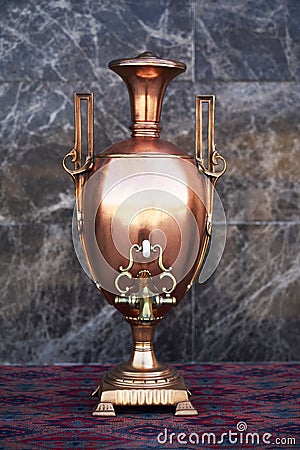 Samovar, russian tea pot. Vintage samovar on marble background Stock Photo
