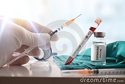 Sample with covid-19 and hand with syringe with vaccine dose Stock Photo