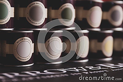 Sample pots of the premium pain Farrow and Ball arranged - for use at home for DIY projects. Editorial Stock Photo