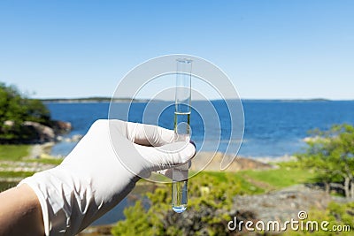 Sample water from the sea for analysis. Sea on background Stock Photo