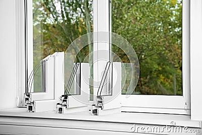 Samples of modern window profiles on sill, space for text. Installation service Stock Photo