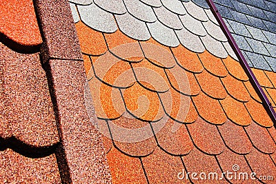 Samples of the roof of the roof. Bituminous tile of different types. Trade in building materials for the home Stock Photo