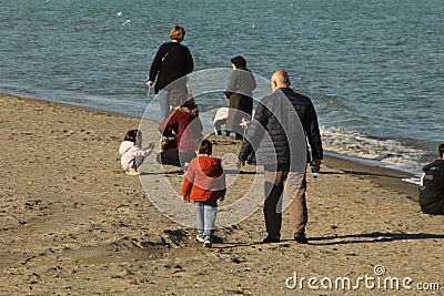 Samsun,Turkey - November 27, 2022 A grandpa taking a walk with his grandchildren Editorial Stock Photo