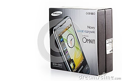 Samsung Omnia SGH-i900 old touch screen mobile phone Windows Mobile 6 smartphone product shot isolated Original Polish product box Editorial Stock Photo