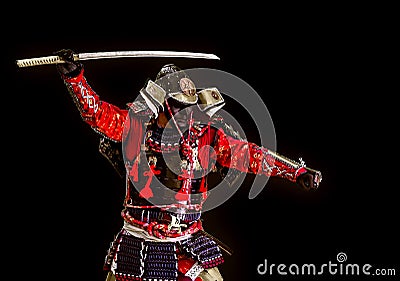 Samurai in ancient armor with a sword attack Stock Photo