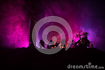 Samurai fighting concept. Silhouette of samurais in duel near tree and old temple. Picture with two samurais and sunset sky. Selec Stock Photo