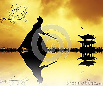Samurai with swords at sunset Stock Photo