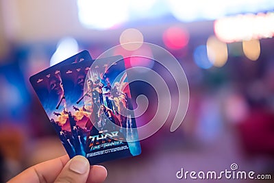 Samut Prakan, Thailand - June 26, 2022: Man hand holding Thor Love and Thunder collection card, movie in july 6, 2022 in Thailand Editorial Stock Photo