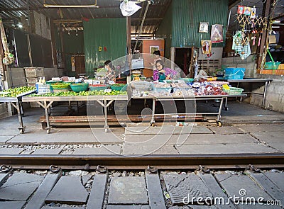 Samut Sakhon, Thailand-November 15, 2020: vegetable vendor in Mae Klong Railway Market Hoop Rom Market, Samut Songkhram Province Editorial Stock Photo