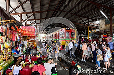 Samut Songkhram, Thailand - August 24, 2019 : Crowd of tourist at Mae Klong train station Editorial Stock Photo