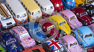 Samut Songkhram, Thailand - August22,2020 : Rows of many miniature retro vehicle toys on table top for sale in generic market Editorial Stock Photo