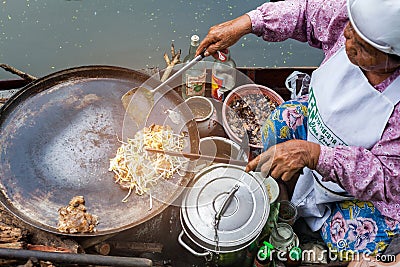 Samut songkram, Thailand - November 11, 2017: cooking food fried - delicious Thai food at Tha Kha floating market Editorial Stock Photo