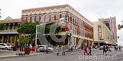 San Antonio, Texas, U.S - April 6, 2024 - The pedestrians crossing the road in front of Dullnig Building Editorial Stock Photo