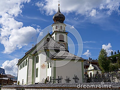 San Cassiano, Alta Badia, Italy. The church in the center of the town. Typical Tyrolean architecture. Stock Photo